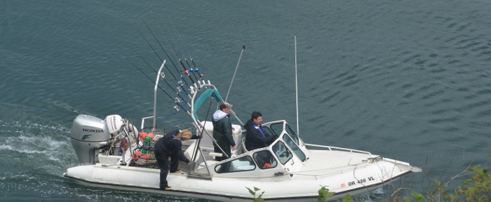 small fishing boat comes in to Depoe Bay harbor